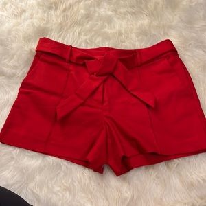 Gorgeous red dress shorts with front full pleat, fabric belt to match.